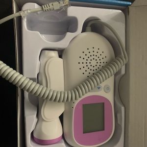 Grey and purple fetal Doppler . Measure and track baby right at home!